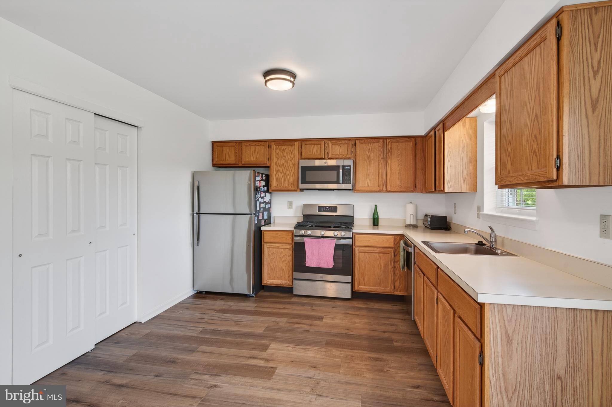 122 Longford Road West Chester, PA 19380 - Photo 10 of 39 a kitchen with a refrigerator sink and cabinets
