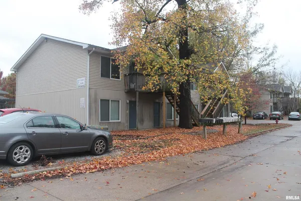 a view of a car parked in front of a house