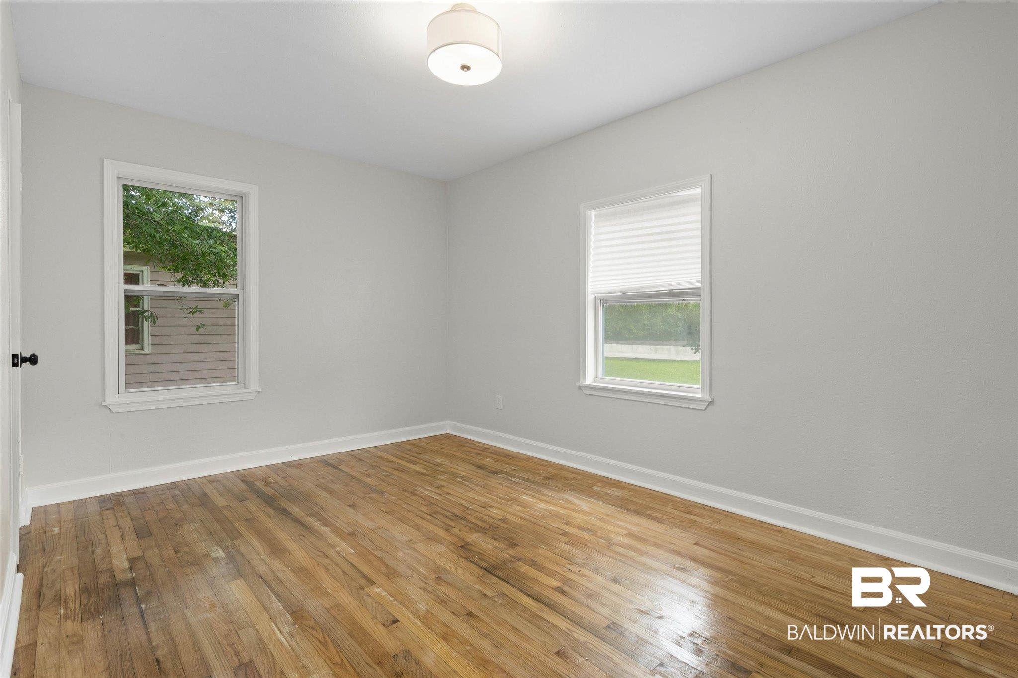 3512 Spring Hill Avenue Mobile, AL 36608 - Photo 13 of 20 Empty room with baseboards and hardwood / wood-style floors