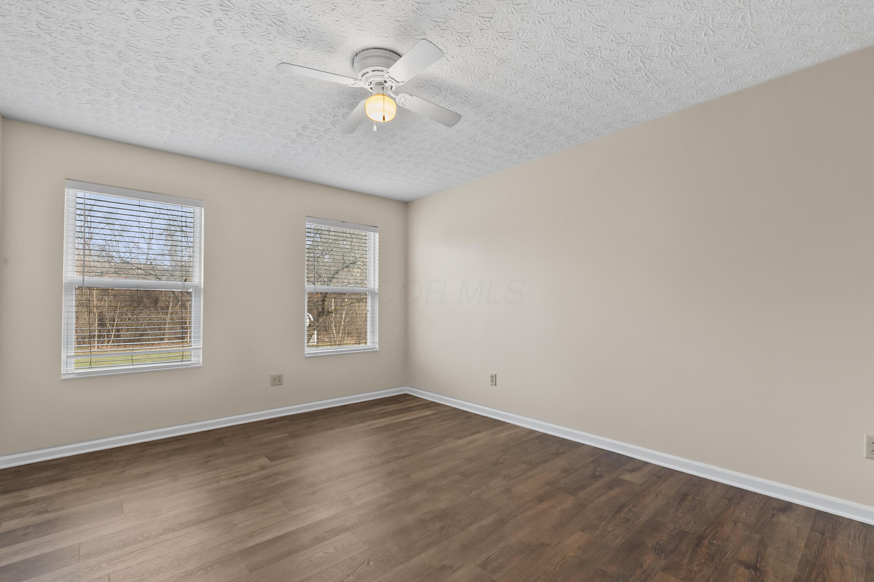 30 Tabilore Loop Delaware, OH 43015 - Photo 29 of 55 • New luxury vinyl plank flooring ~ 2025 • Tan painted walls • Lighted ceiling fan • Linen closet with sliding doors • 2” blinds
