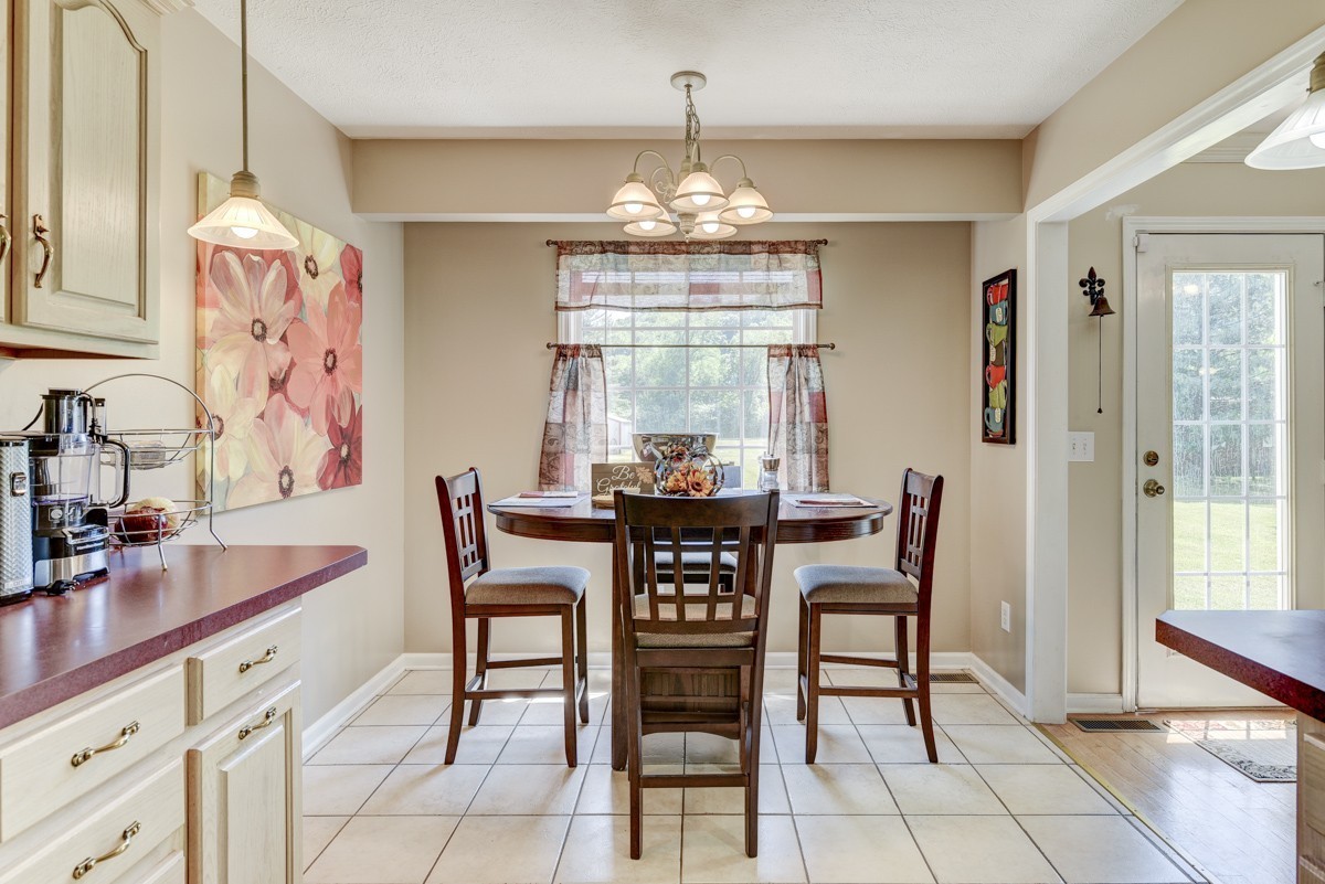 3011 Tyree Springs Road Hendersonville, TN 37075 - Photo 11 of 43 a dining room with furniture a chandelier and window