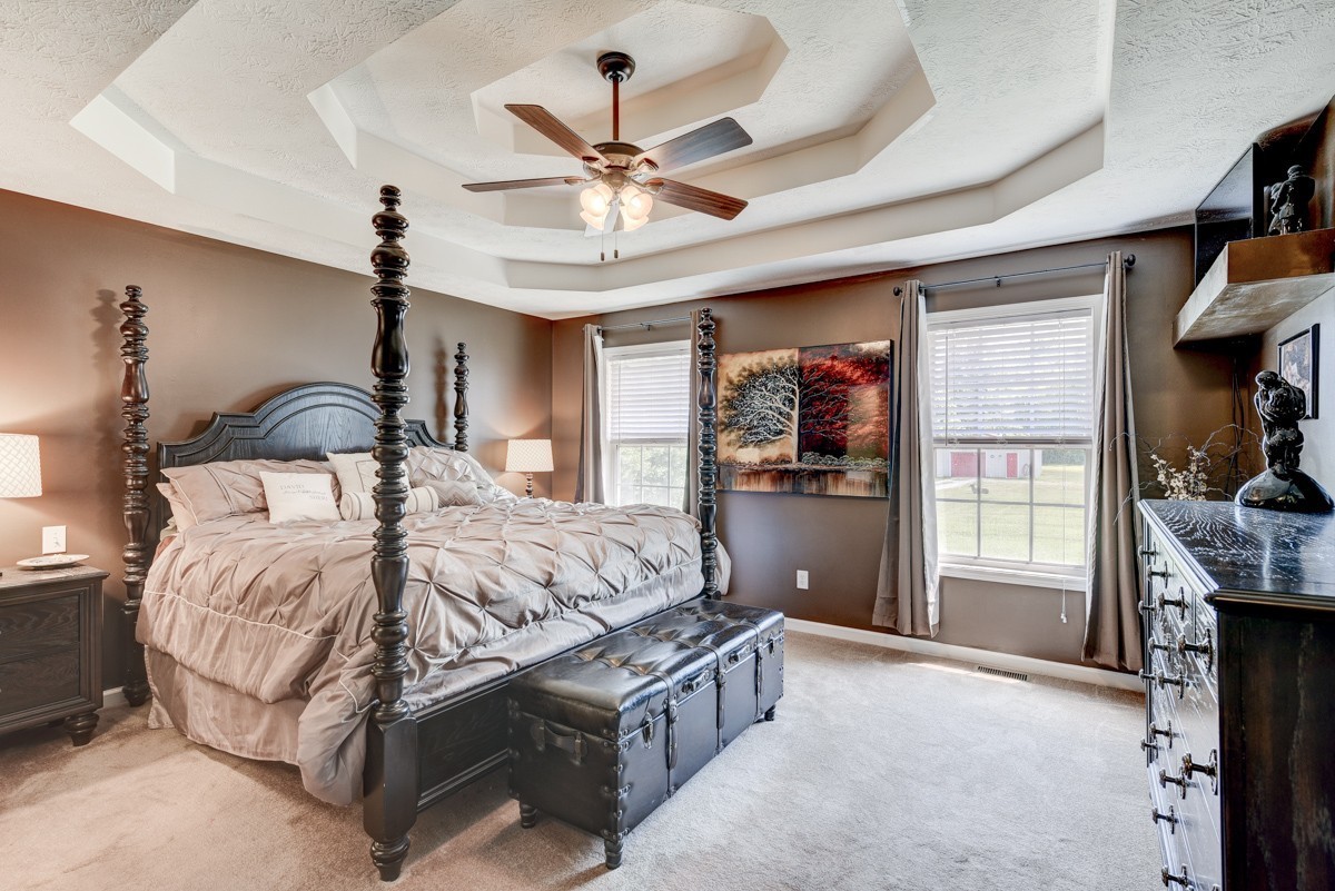 3011 Tyree Springs Road Hendersonville, TN 37075 - Photo 13 of 43 a bedroom with a bed and a chandelier