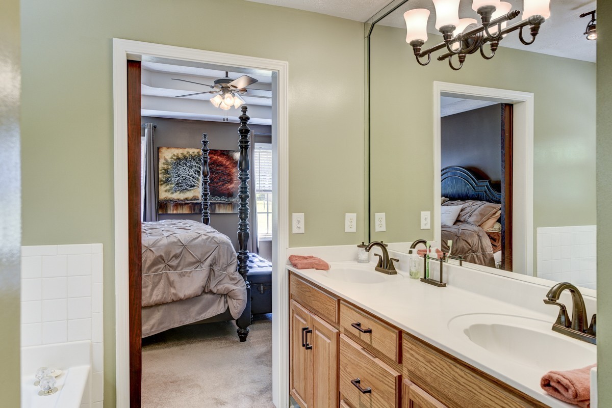 3011 Tyree Springs Road Hendersonville, TN 37075 - Photo 20 of 43 a en suite bathroom with a granite countertop sink and a mirror