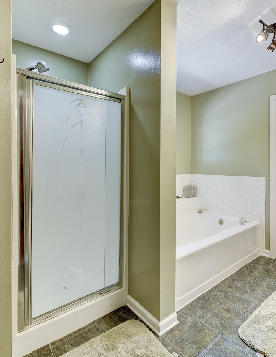 3011 Tyree Springs Road Hendersonville, TN 37075 - Photo 21 of 43 a bathroom with a bathtub and a shower