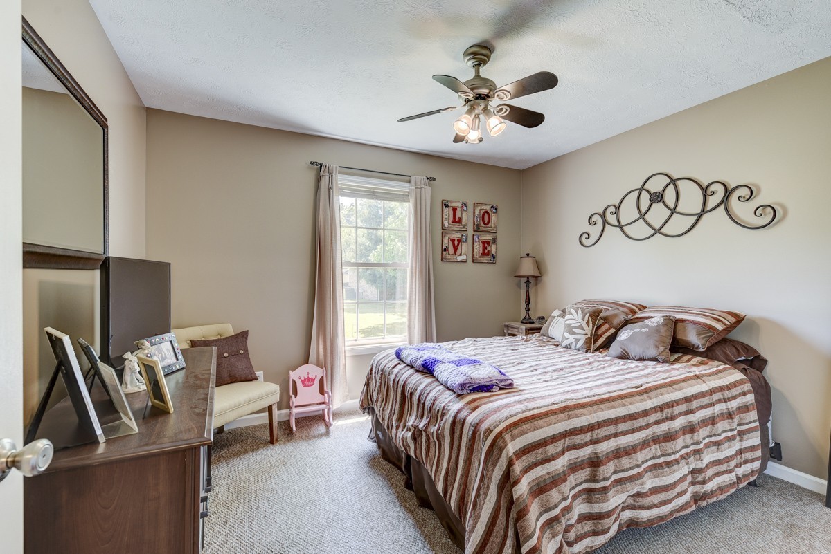 3011 Tyree Springs Road Hendersonville, TN 37075 - Photo 22 of 43 a bedroom with a bed and ceiling fan