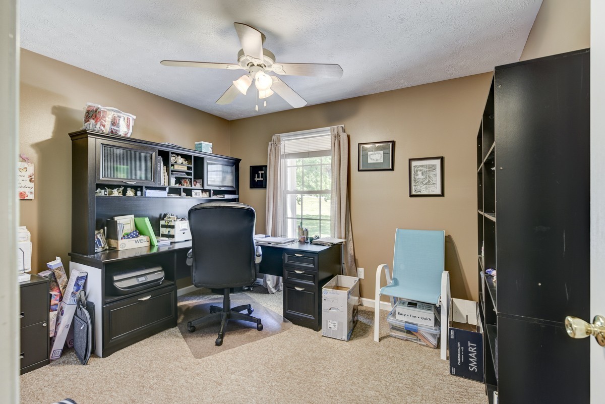 3011 Tyree Springs Road Hendersonville, TN 37075 - Photo 24 of 43 a view of a workspace with furniture and a window