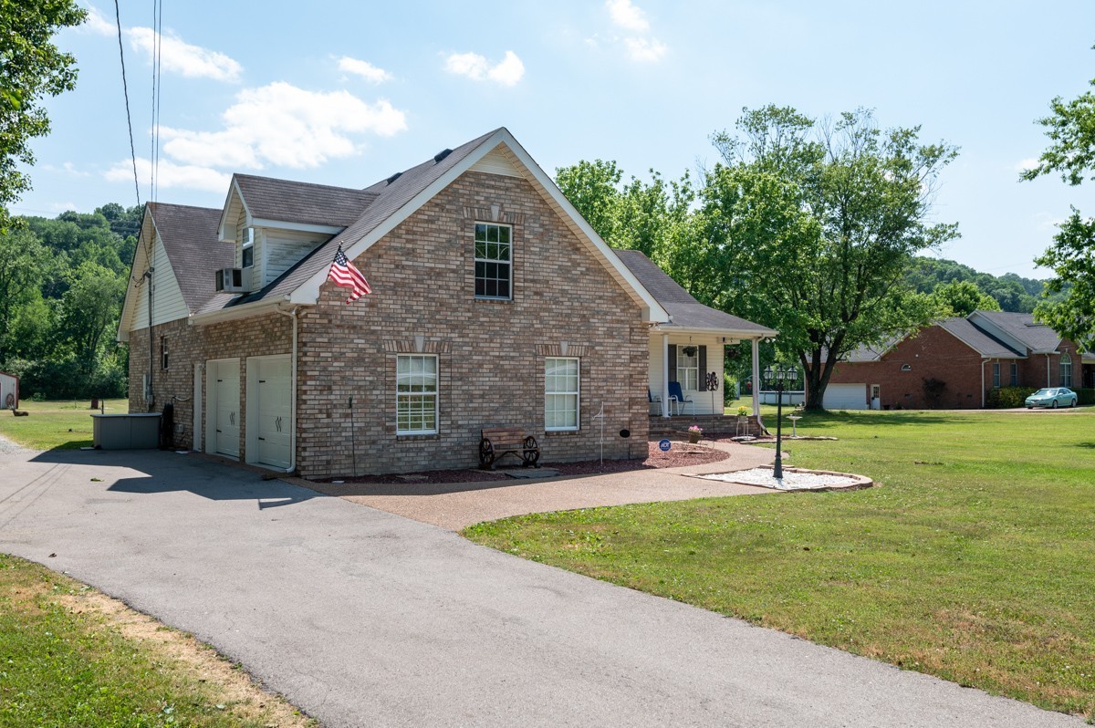 3011 Tyree Springs Road Hendersonville, TN 37075 - Photo 43 of 43 a front view of house with a garden and patio