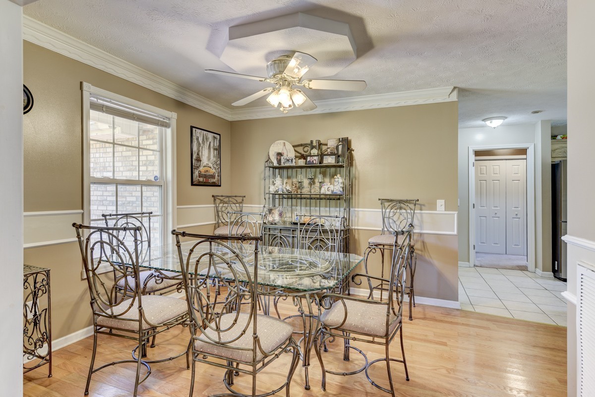 3011 Tyree Springs Road Hendersonville, TN 37075 - Photo 6 of 43 a view of a dining room with furniture and wooden floor