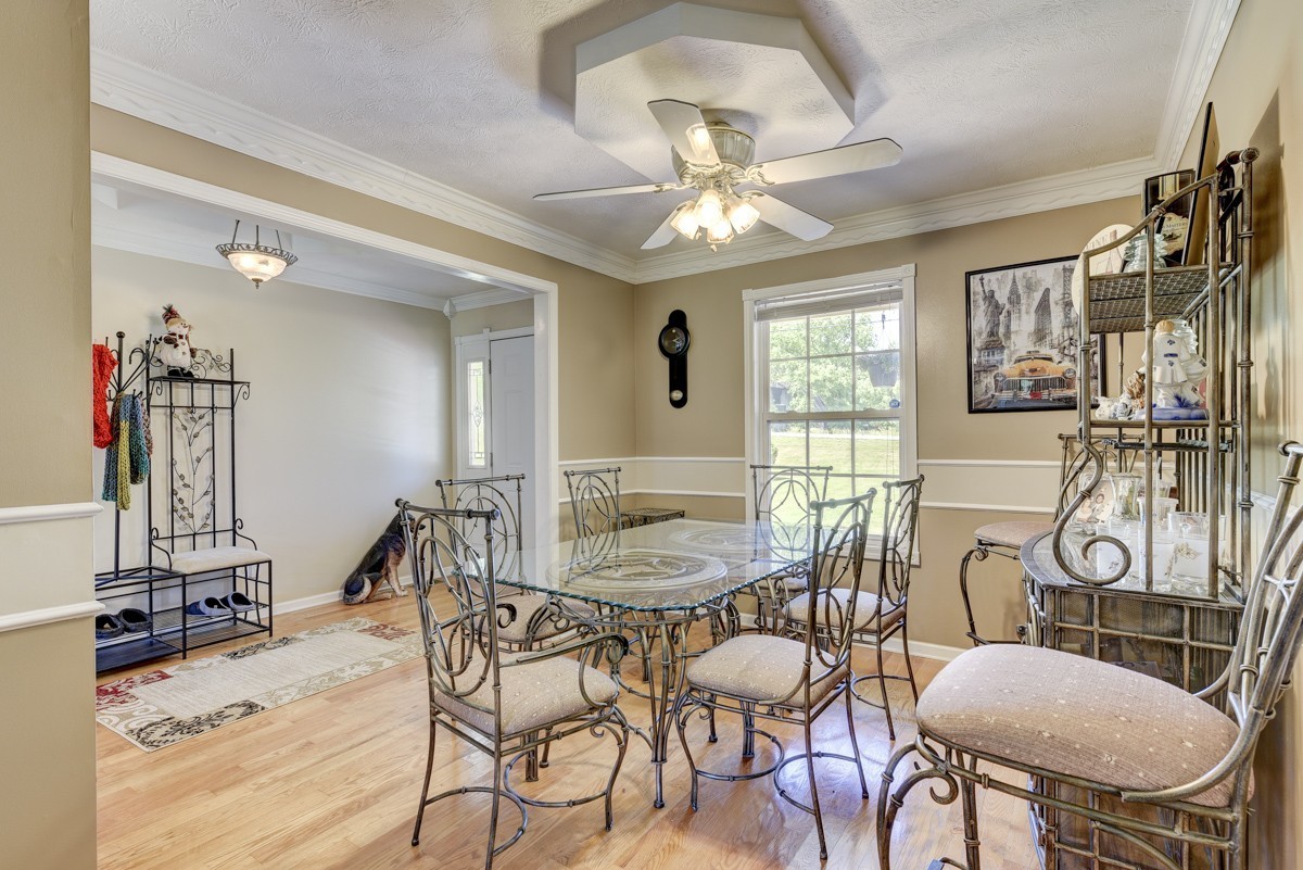 3011 Tyree Springs Road Hendersonville, TN 37075 - Photo 7 of 43 a view of a dining room with furniture and a chandelier