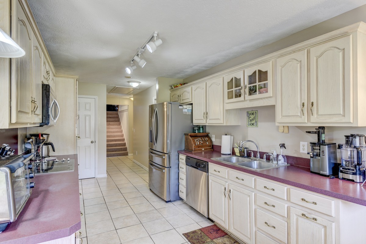 3011 Tyree Springs Road Hendersonville, TN 37075 - Photo 8 of 43 a kitchen with stainless steel appliances granite countertop a refrigerator and a sink