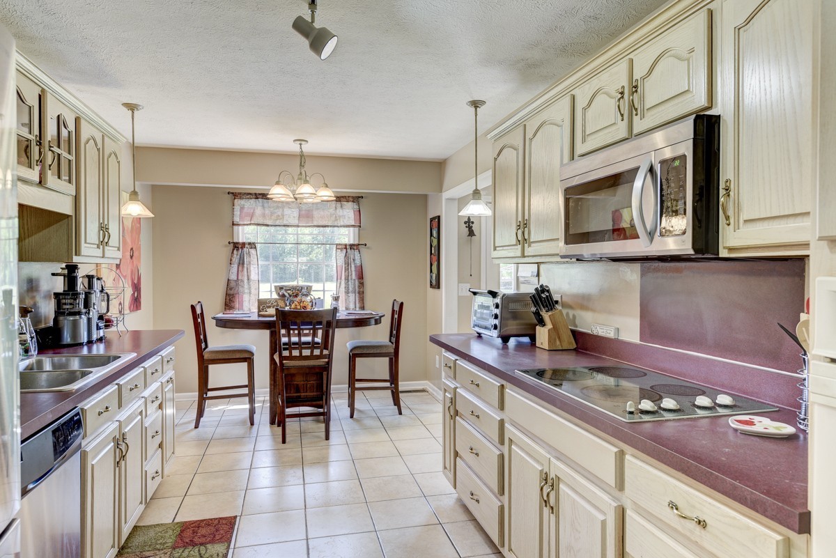 3011 Tyree Springs Road Hendersonville, TN 37075 - Photo 10 of 43 a kitchen with stainless steel appliances granite countertop a sink and cabinets