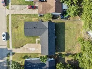aerial view of a house with a garden