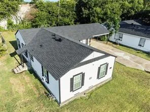 a view of a house with pool and yard