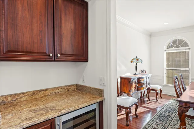 a view of room with furniture and wooden floor