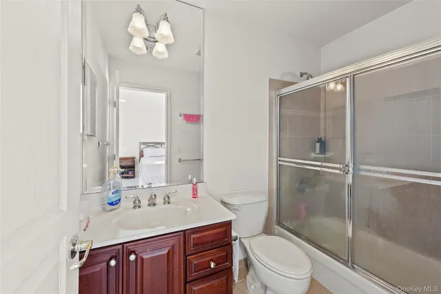 a bedroom with a bed and windows