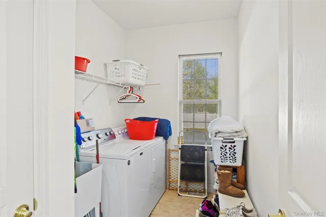a living room with lots of furniture and clutter