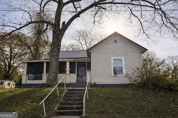 a front view of a house with yard