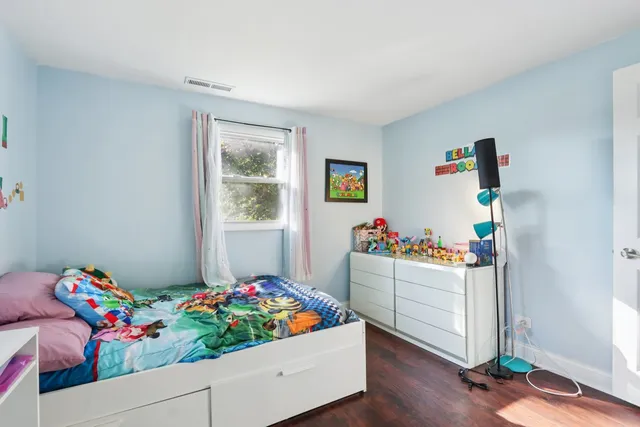a room with toys and wooden floor