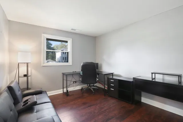 a workspace with furniture and lamp