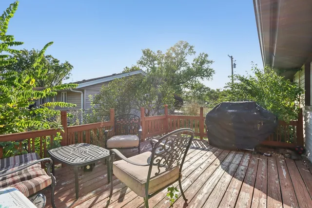 a view of a balcony with furniture