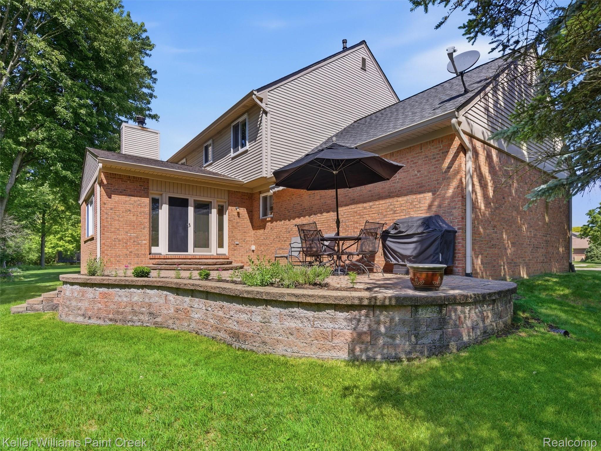 2842 Manorwood Road Troy, MI 48085 - Photo 72 of 72 Expansive brick exterior with a two-story design and a contrasting siding upper level
