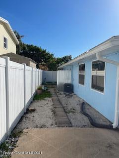 1034 Bali Road Cocoa Beach, FL 32931 - Photo 2 of 40 a house view with a backyard space
