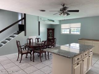1034 Bali Road Cocoa Beach, FL 32931 - Photo 12 of 40 a dining room with furniture and window