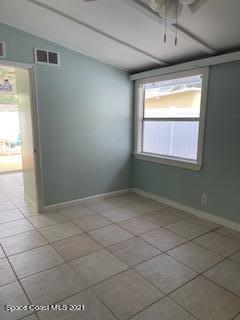 1034 Bali Road Cocoa Beach, FL 32931 - Photo 17 of 40 a view of an empty room and window