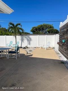 1034 Bali Road Cocoa Beach, FL 32931 - Photo 3 of 40 a view of a terrace with a bench