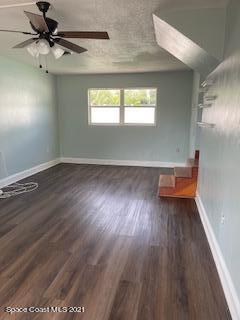 1034 Bali Road Cocoa Beach, FL 32931 - Photo 21 of 40 an empty room with wooden floor and windows