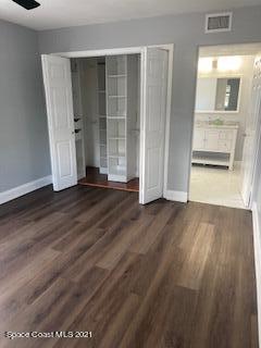 1034 Bali Road Cocoa Beach, FL 32931 - Photo 26 of 40 wooden floor in an empty room with a window