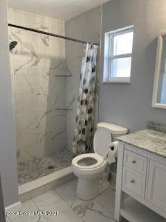1034 Bali Road Cocoa Beach, FL 32931 - Photo 28 of 40 a bathroom with a toilet and a shower