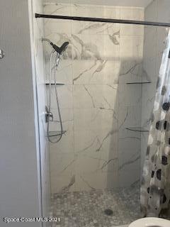 1034 Bali Road Cocoa Beach, FL 32931 - Photo 29 of 40 a bathroom with a shower