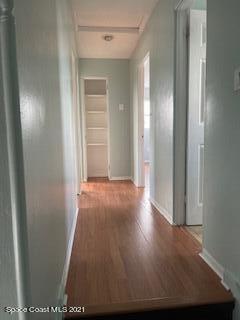 1034 Bali Road Cocoa Beach, FL 32931 - Photo 32 of 40 a view of a hallway with wooden floor