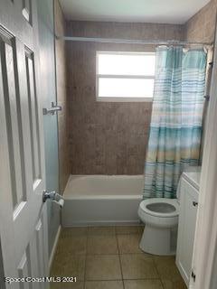 1034 Bali Road Cocoa Beach, FL 32931 - Photo 33 of 40 a bathroom with a toilet and a shower