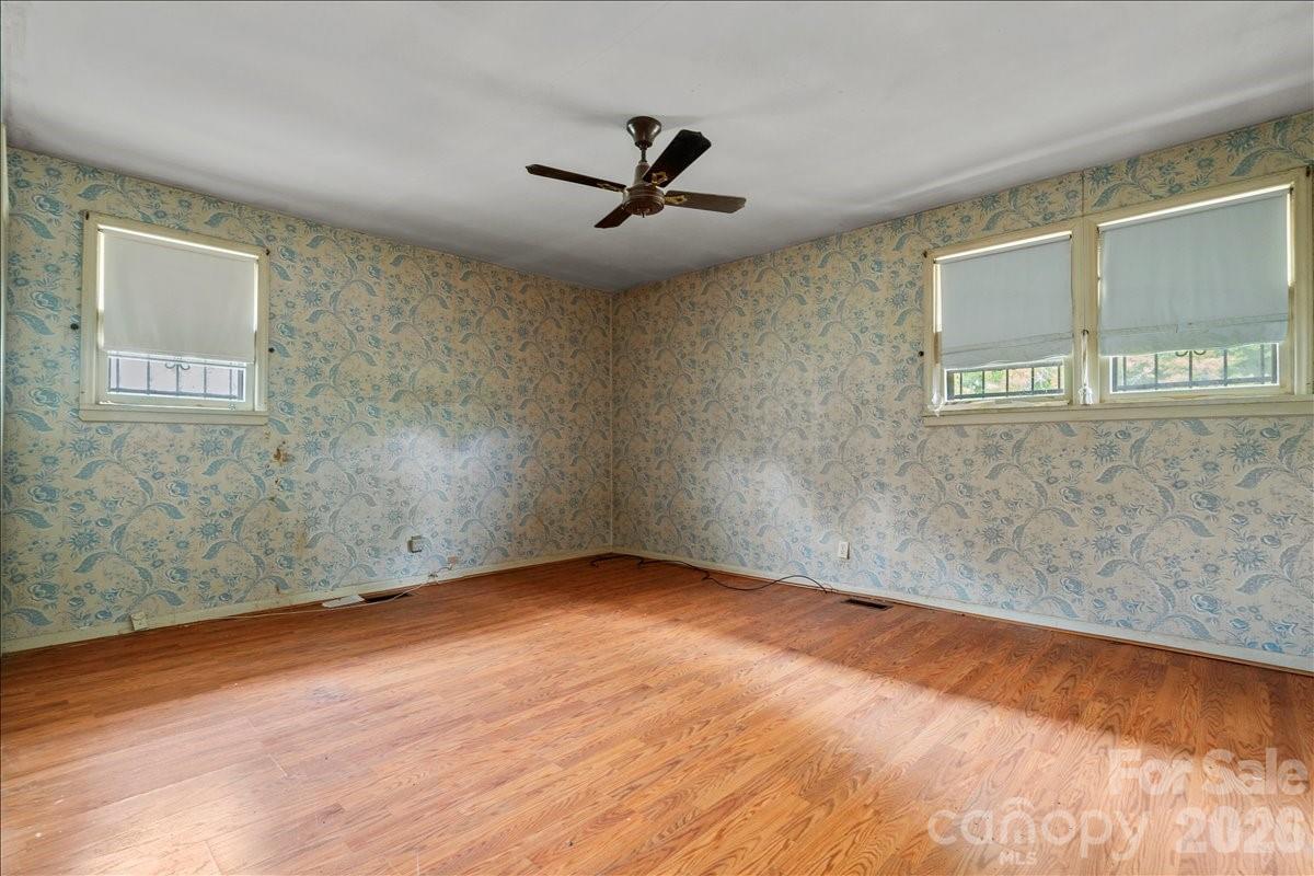 1444 Society Hill Road Darlington, SC 29540 - Photo 18 of 35 an empty room with wooden floor and windows