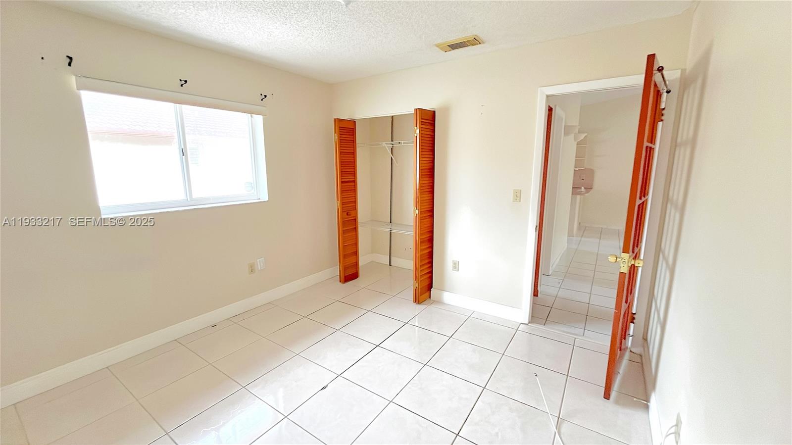 2220 West 74th Street, Unit 20116 Hialeah, FL 33016 - Photo 11 of 23 a view of room with window and bathroom