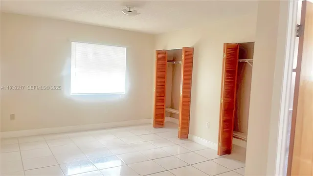 a white refrigerator freezer sitting in a kitchen
