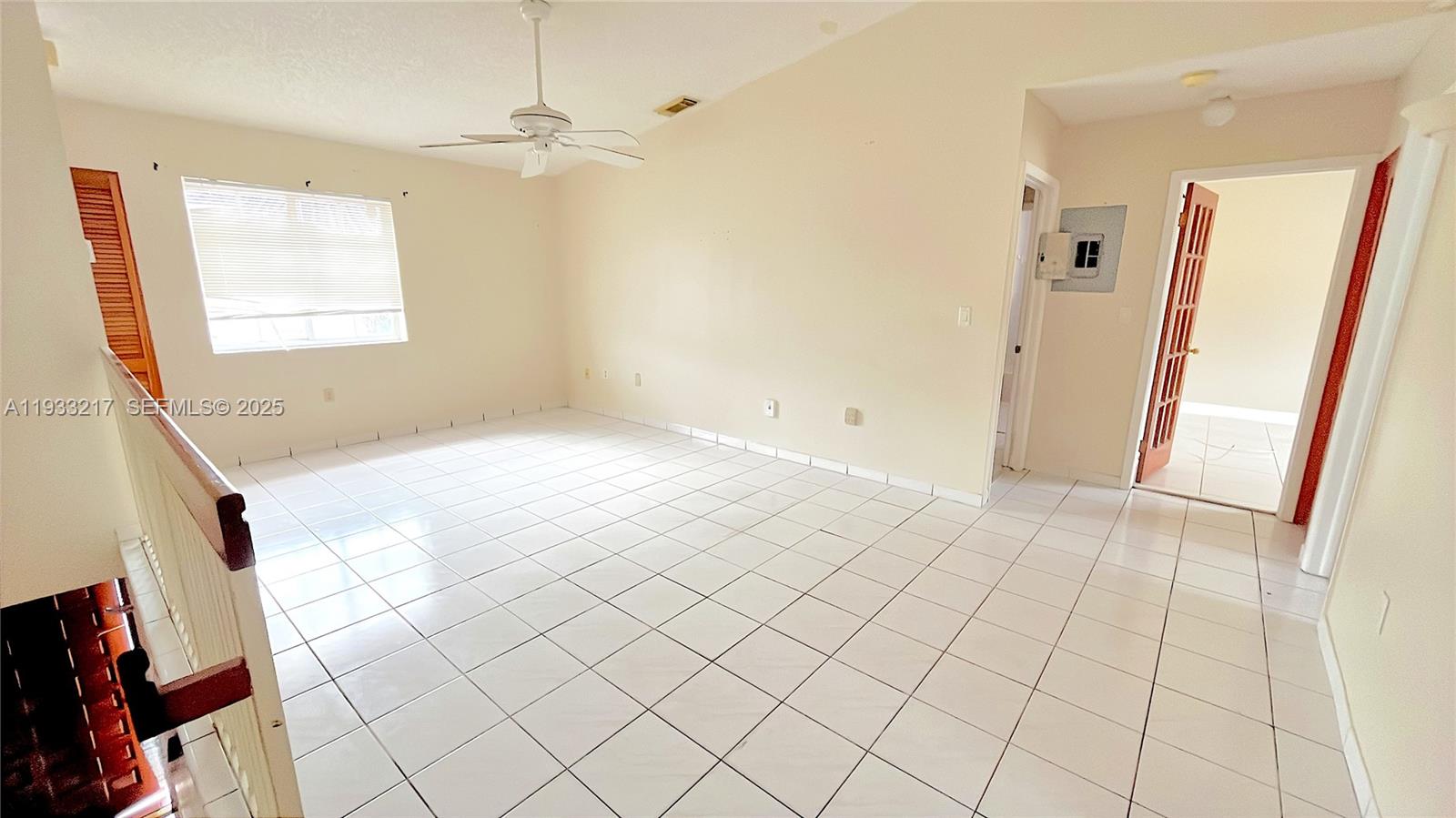 2220 West 74th Street, Unit 20116 Hialeah, FL 33016 - Photo 21 of 23 a view of an empty room and window