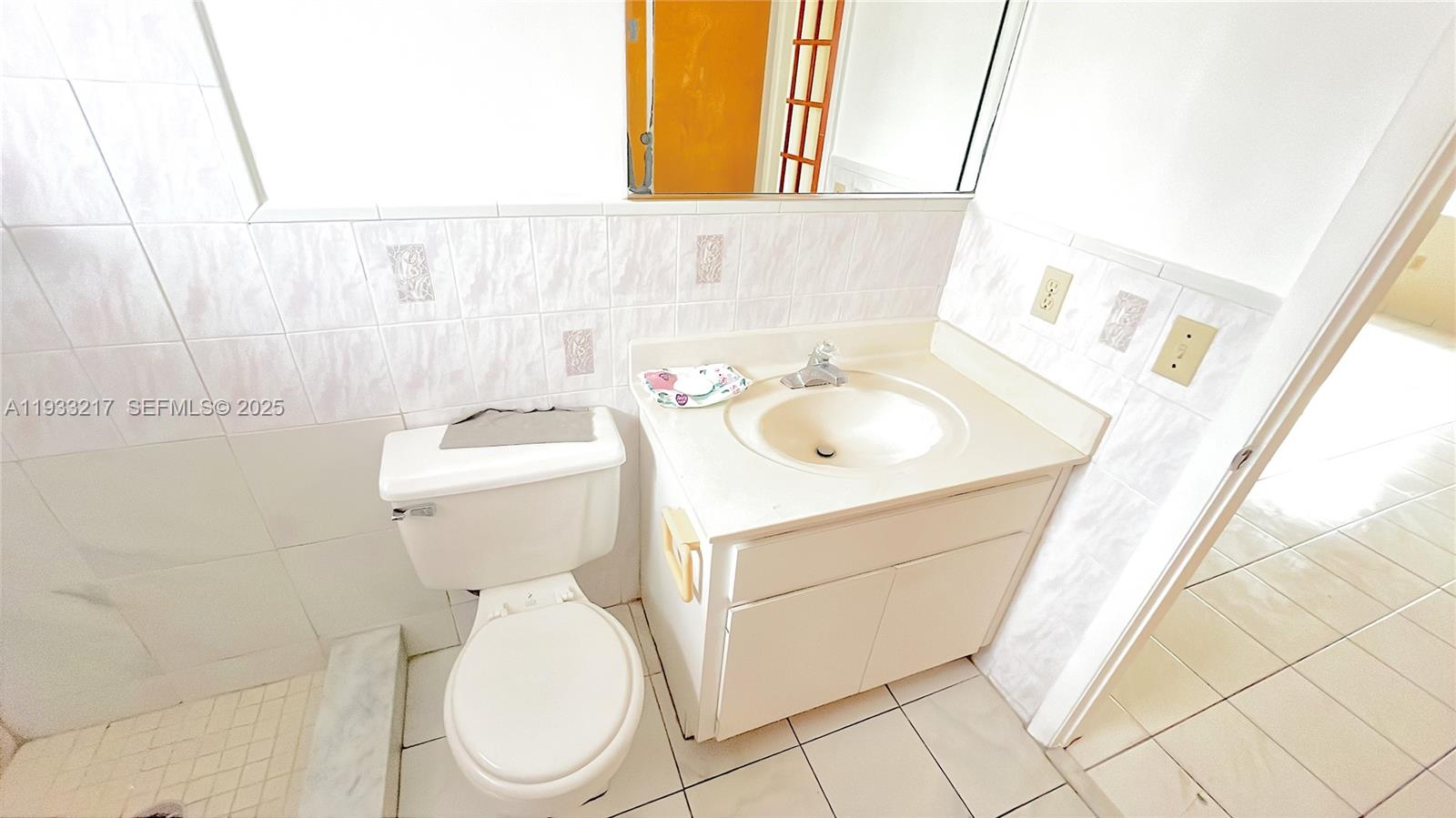 2220 West 74th Street, Unit 20116 Hialeah, FL 33016 - Photo 5 of 23 a bathroom with a sink toilet and mirror
