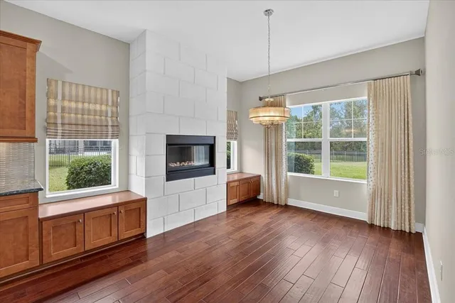 a view of a livingroom with furniture and a flat screen tv