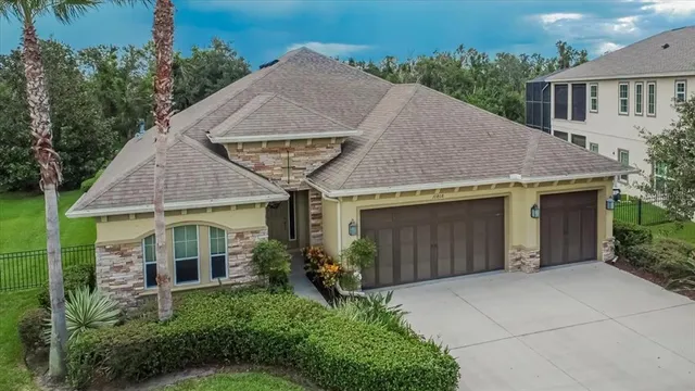 a aerial view of a house with yard and plants
