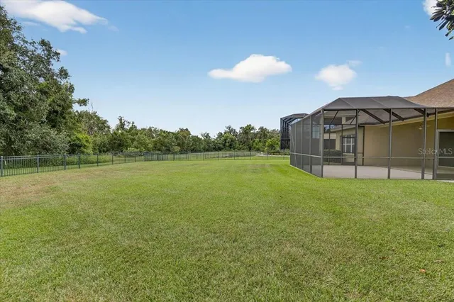 a front view of house with yard and trees