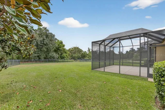 an aerial view of a house with garden space and street view