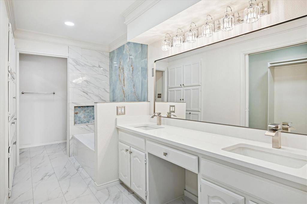 62 Legend Road Benbrook, TX 76132 - Photo 15 of 27 Beautiful primary bath with double sinks, separate tub and shower and walk-in closet.