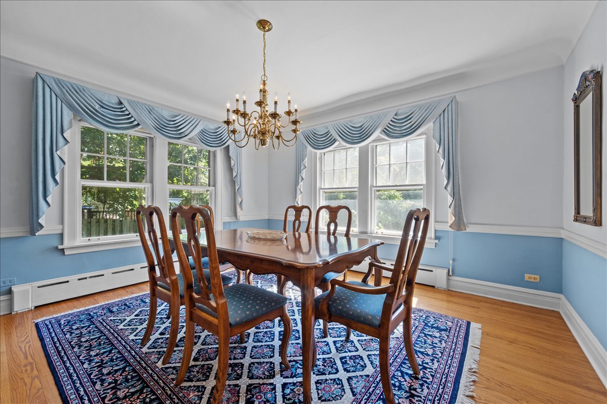 27 Logan Terrace Golf, IL 60029 - Photo 11 of 30 a view of a dining room with furniture window and wooden floor