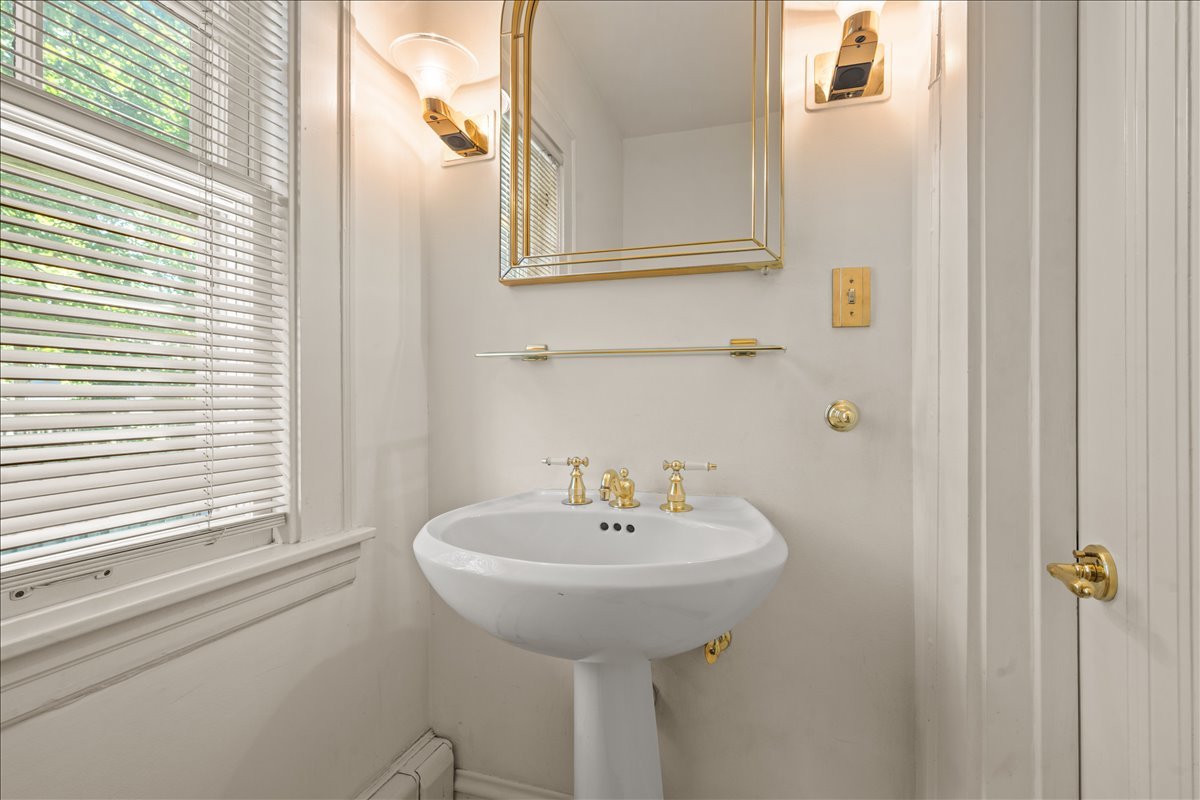 27 Logan Terrace Golf, IL 60029 - Photo 12 of 30 a bathroom with a sink and a window