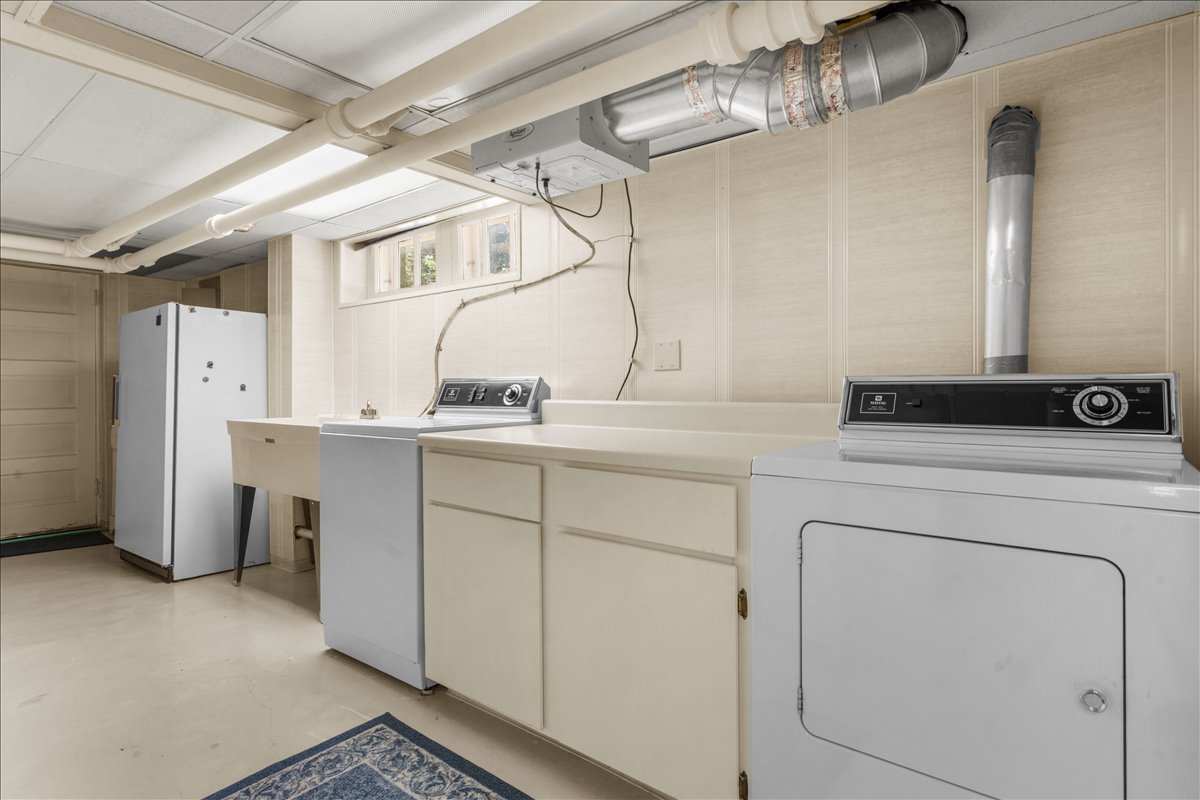 27 Logan Terrace Golf, IL 60029 - Photo 23 of 30 a utility room with closet dryer and washer