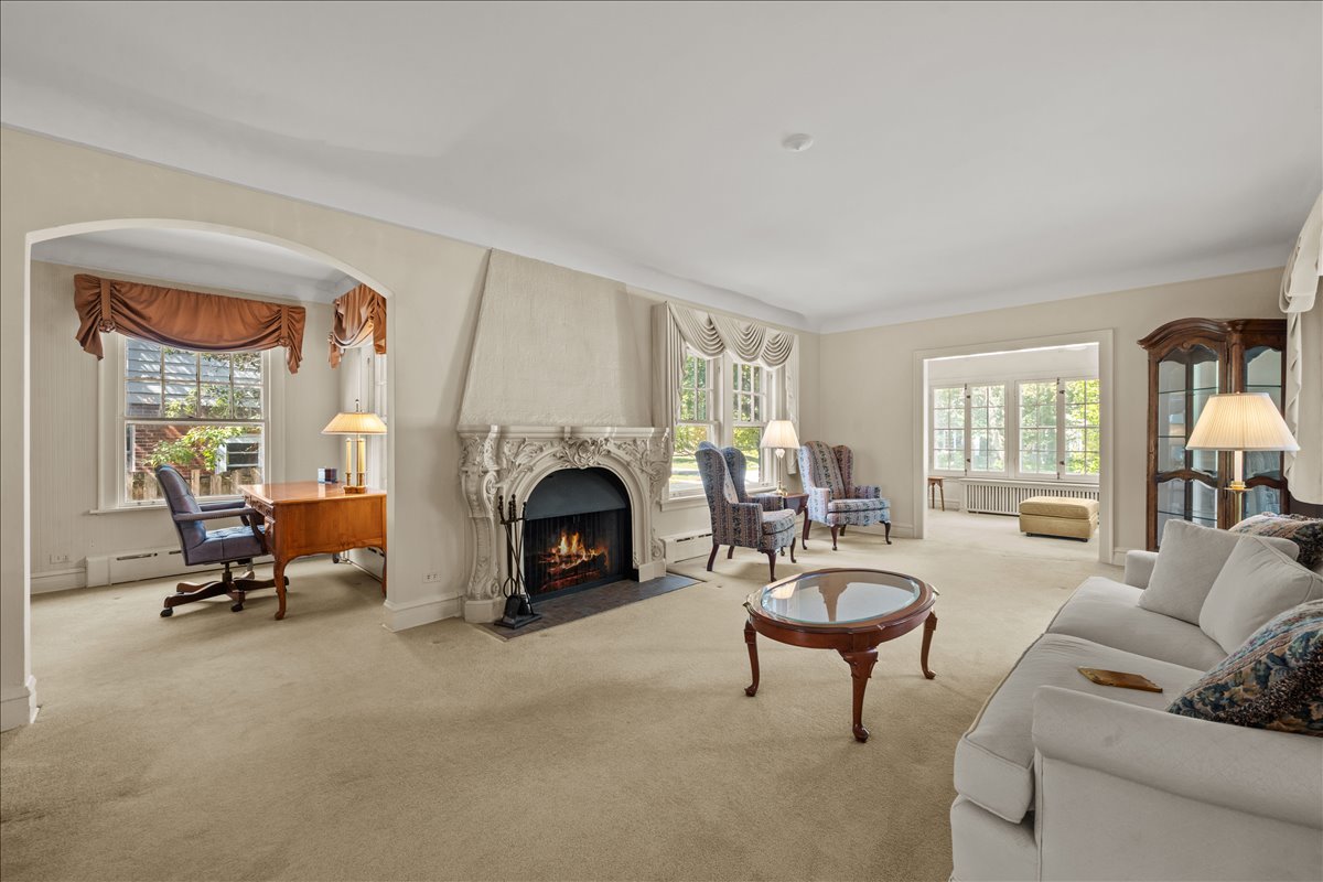27 Logan Terrace Golf, IL 60029 - Photo 4 of 30 a living room with furniture and a fireplace