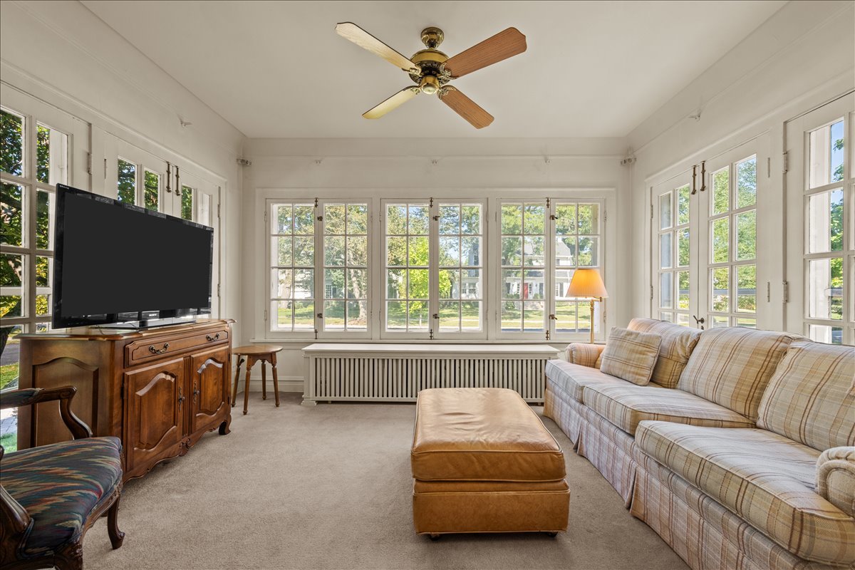 27 Logan Terrace Golf, IL 60029 - Photo 7 of 30 a living room with furniture and a flat screen tv
